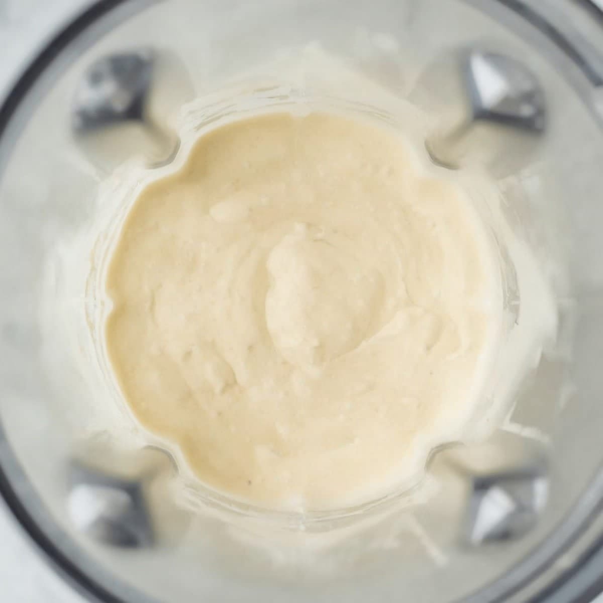 Smooth blended cottage cheese pancake batter in a glass blender jar