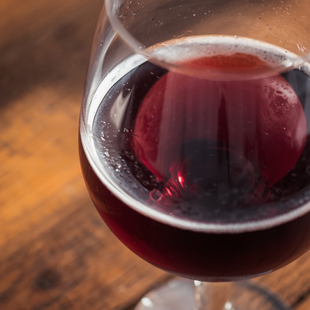 A glass of homemade non alcoholic wine on a table