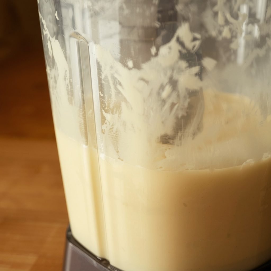 Blueberry cottage cheese breakfast bake batter being blended smooth in a blender