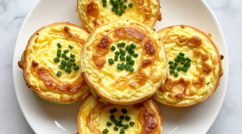 Egg bites recipes stacked on a plate with fresh herbs